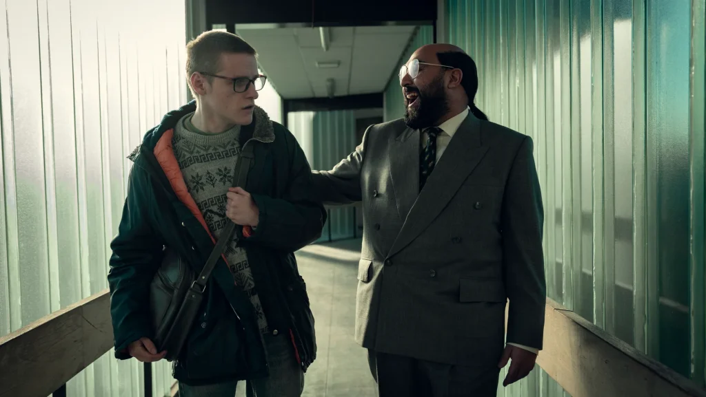 Lewis Gribben and returning star Asim Chaudhry in the 'Black Mirror' season seven episode "Plaything." | Netflix
